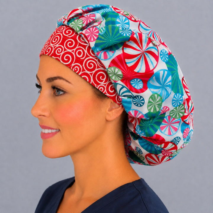 Holiday candy swirl bouffant cap for women, left side profile — handmade peppermint print surgical cap, USA made