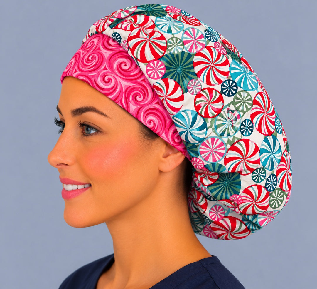 Holiday peppermint bouffant, left side profile — pink swirl band on a handmade candy print surgical cap, USA made