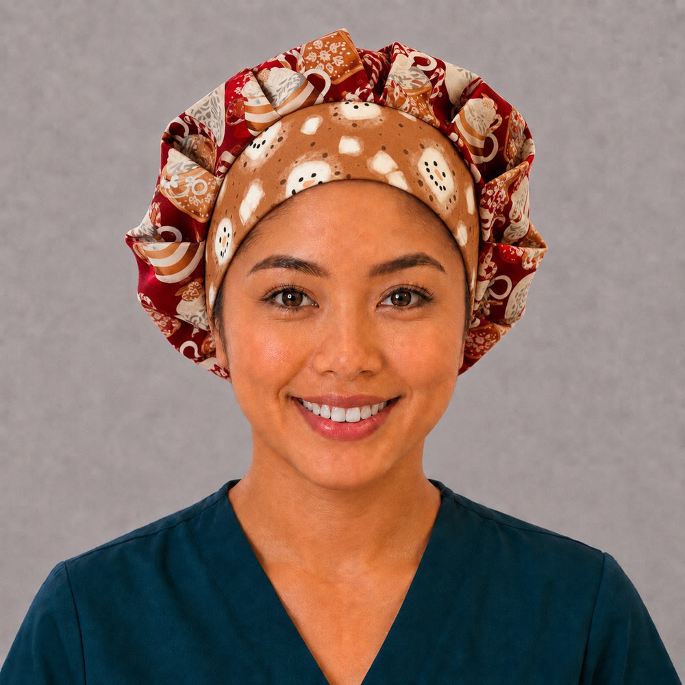 Woman wearing a Christmas hot chocolate bouffant scrub cap, front view — cocoa mugs and marshmallows on cranberry red with a gingerbread snowman band, adjustable women's surgical hat