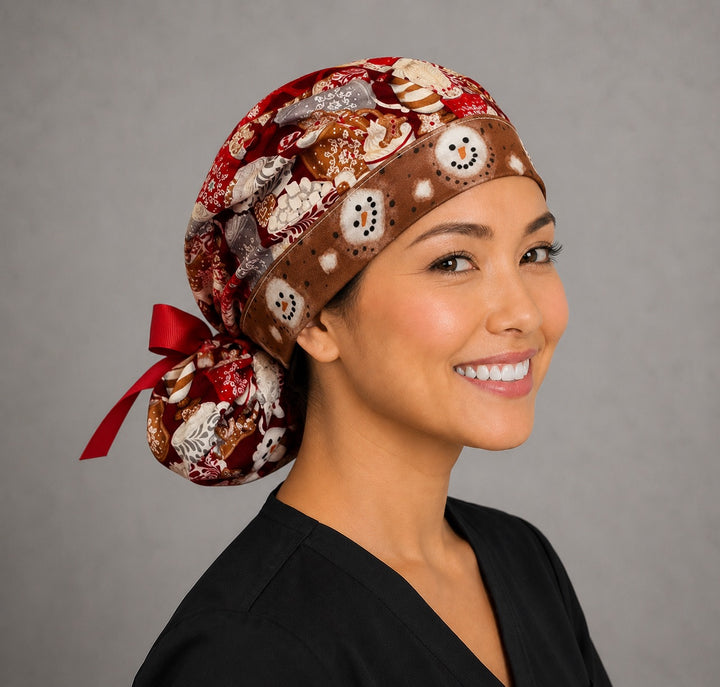 Hot chocolate ponytail scrub cap back view close-up showing gathered pouch full of cocoa mugs, gingerbread, candy canes and marshmallows with red grosgrain ribbon bow