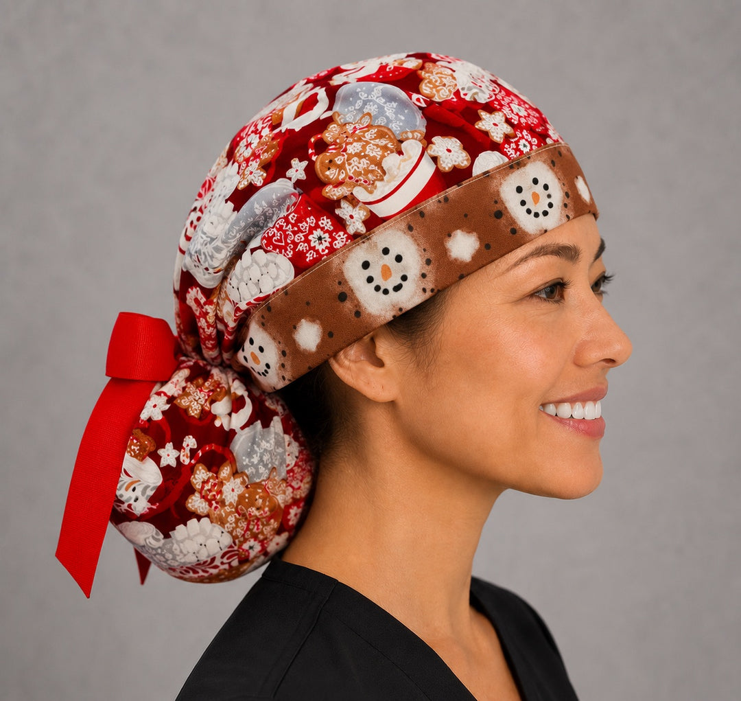 Hot chocolate ponytail scrub cap right side profile with full ponytail pouch of cocoa mugs, gingerbread and marshmallows and long red ribbon ties
