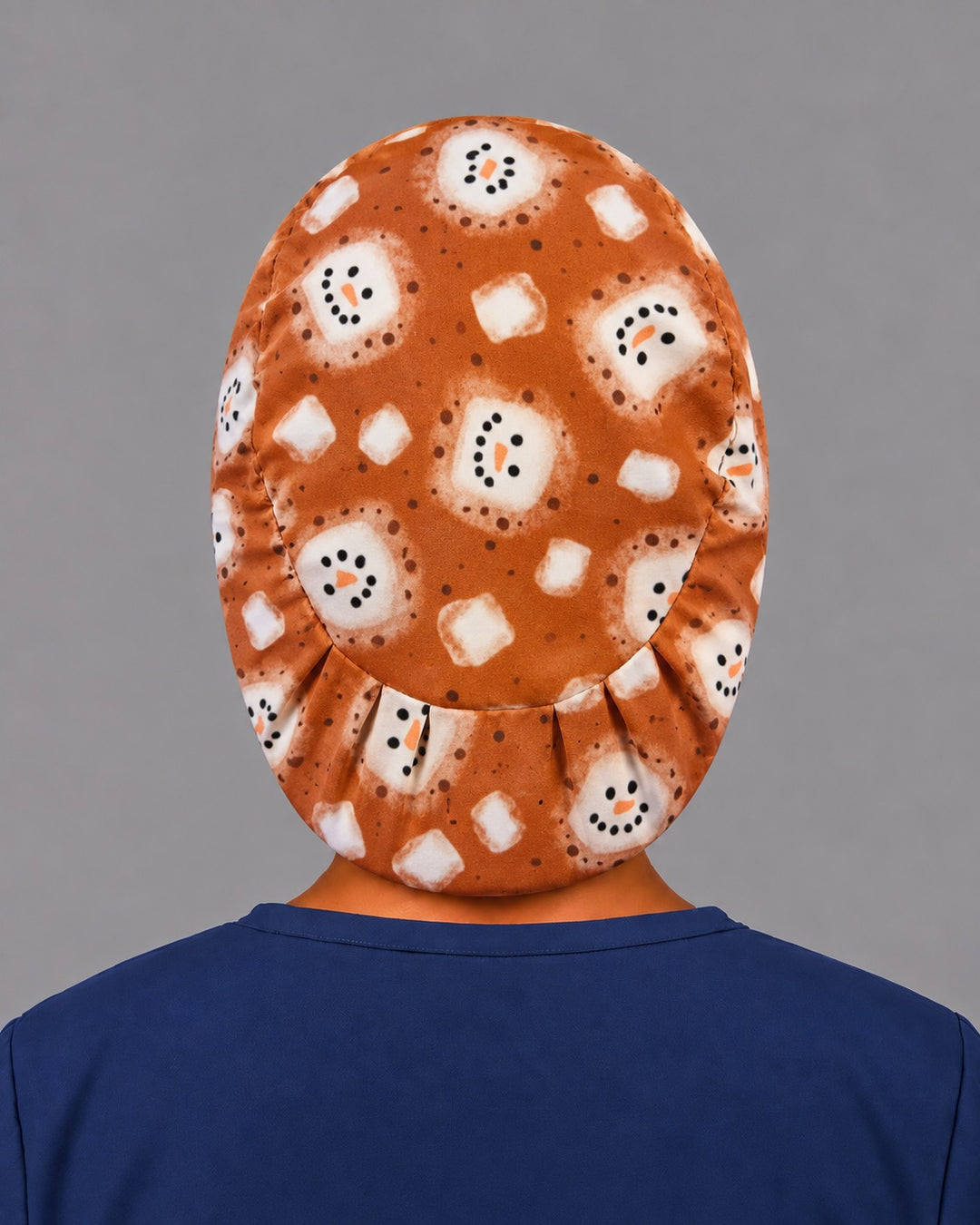 Back view of the hot cocoa Euro scrub cap — elastic gathered back showing marshmallow snowmen across the brown crown