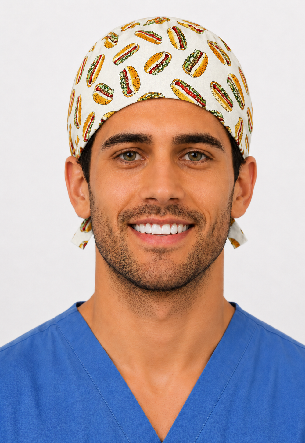 Man wearing a funny hot dog food-print tie-back scrub cap, front view — handmade-in-USA men's surgical hat from OR World.