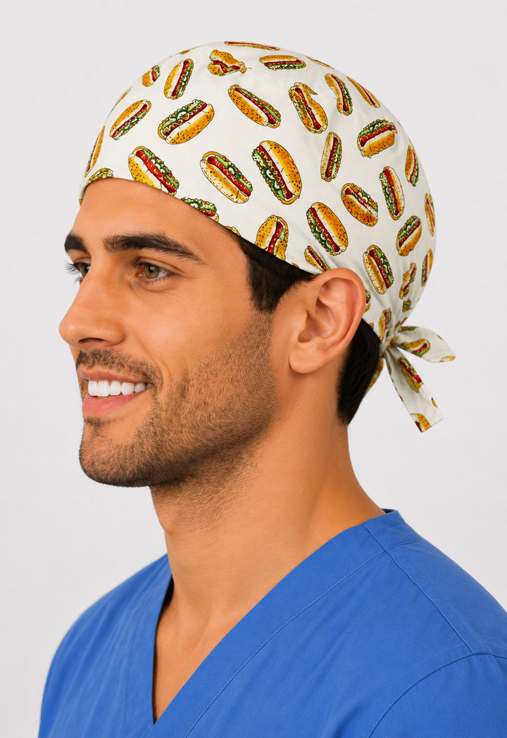 Side view of man in hot dog scrub cap with tie-back — handmade USA funny food-print surgical hat for OR nurses, surgeons &amp; techs.