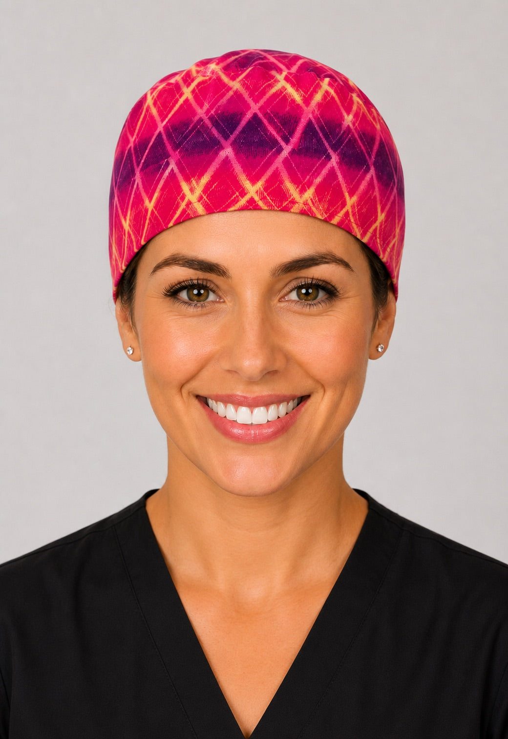Three-quarter view of hot pink and purple tie dye unisex adjustable surgical hat for nurses and surgical techs