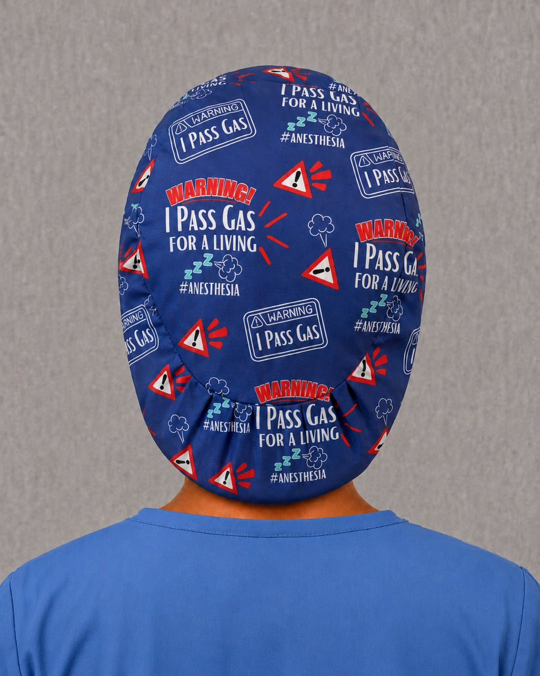 Back view of the I Pass Gas Euro scrub cap — full coverage showing anesthesia warning lettering across the blue crown