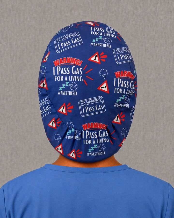 Back view of the I Pass Gas Euro scrub cap — full coverage showing anesthesia warning lettering across the blue crown