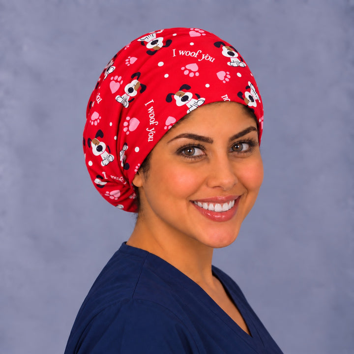 I Woof You Euro scrub cap, right angled smiling view — heart and paw print for OR nurses and vet techs
