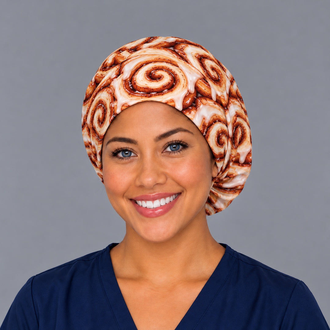 Front view of an iced cinnamon bun euro surgical hat with a smooth forehead band, a funny gift for OR nurses