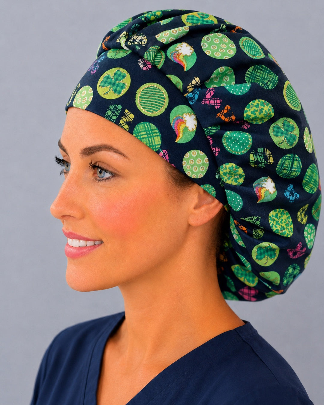 Left side profile of the Irish shamrock dot bouffant surgical hat — clovers, rainbows and plaid circles on navy, roomy breathable cotton cap for nurses