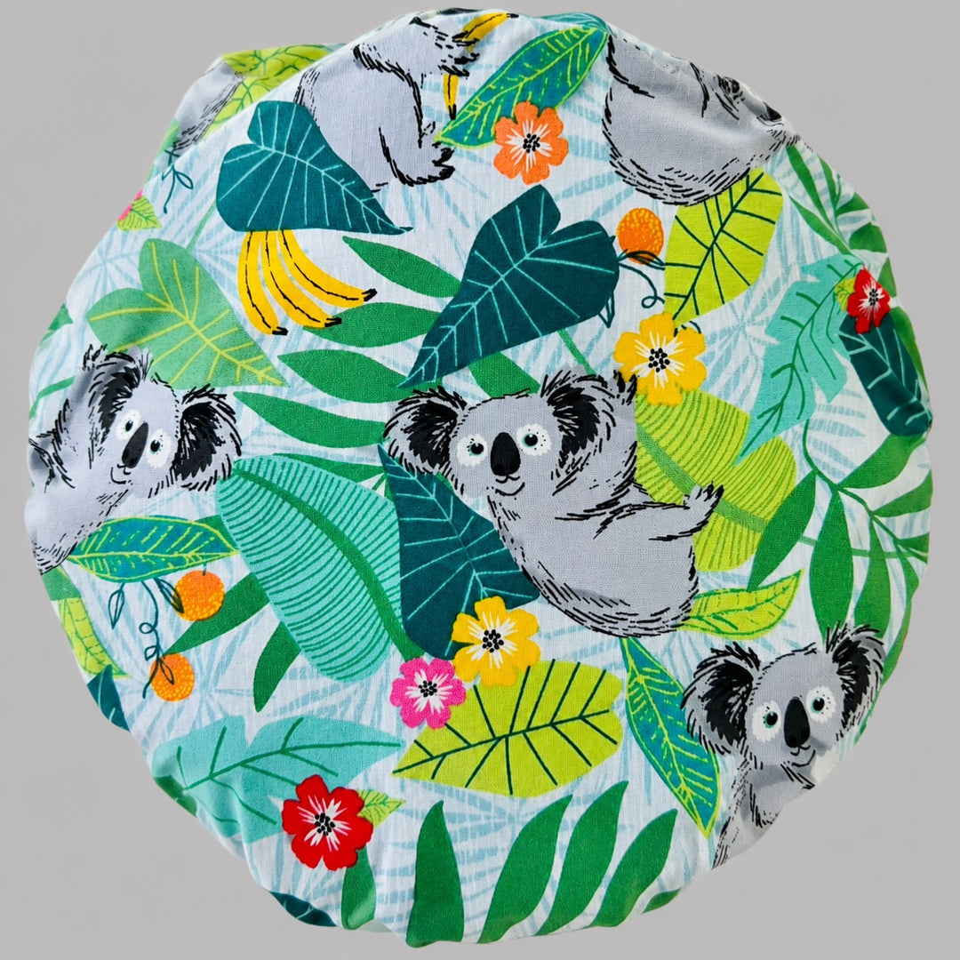 Koala bears tropical leaves bouffant scrub cap fabric close-up showing koalas, eucalyptus, hibiscus and bananas on light blue, OR World Australian wildlife surgical hat