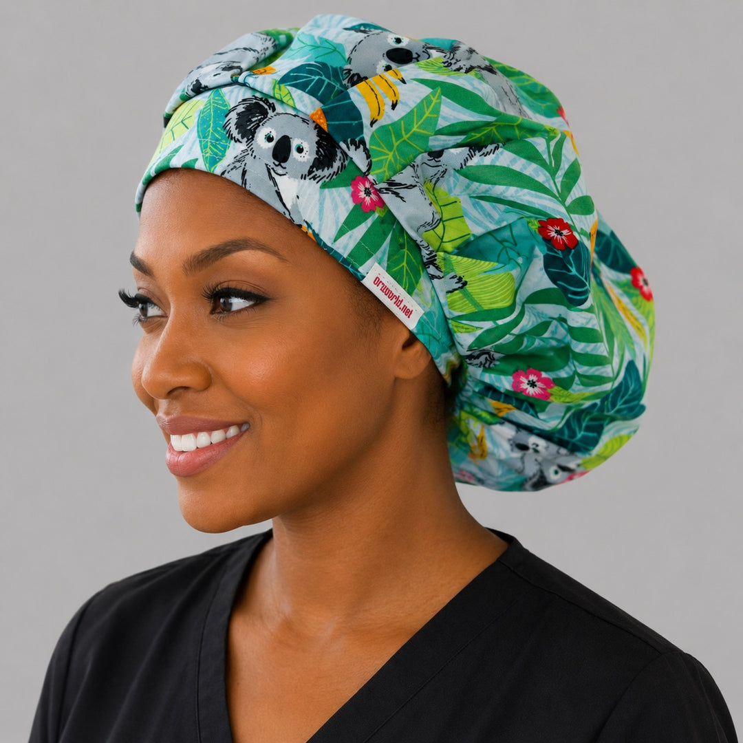 Koala bears tropical leaves bouffant surgical cap left side profile showing koalas, eucalyptus and hibiscus, OR World Australian wildlife nurse hat