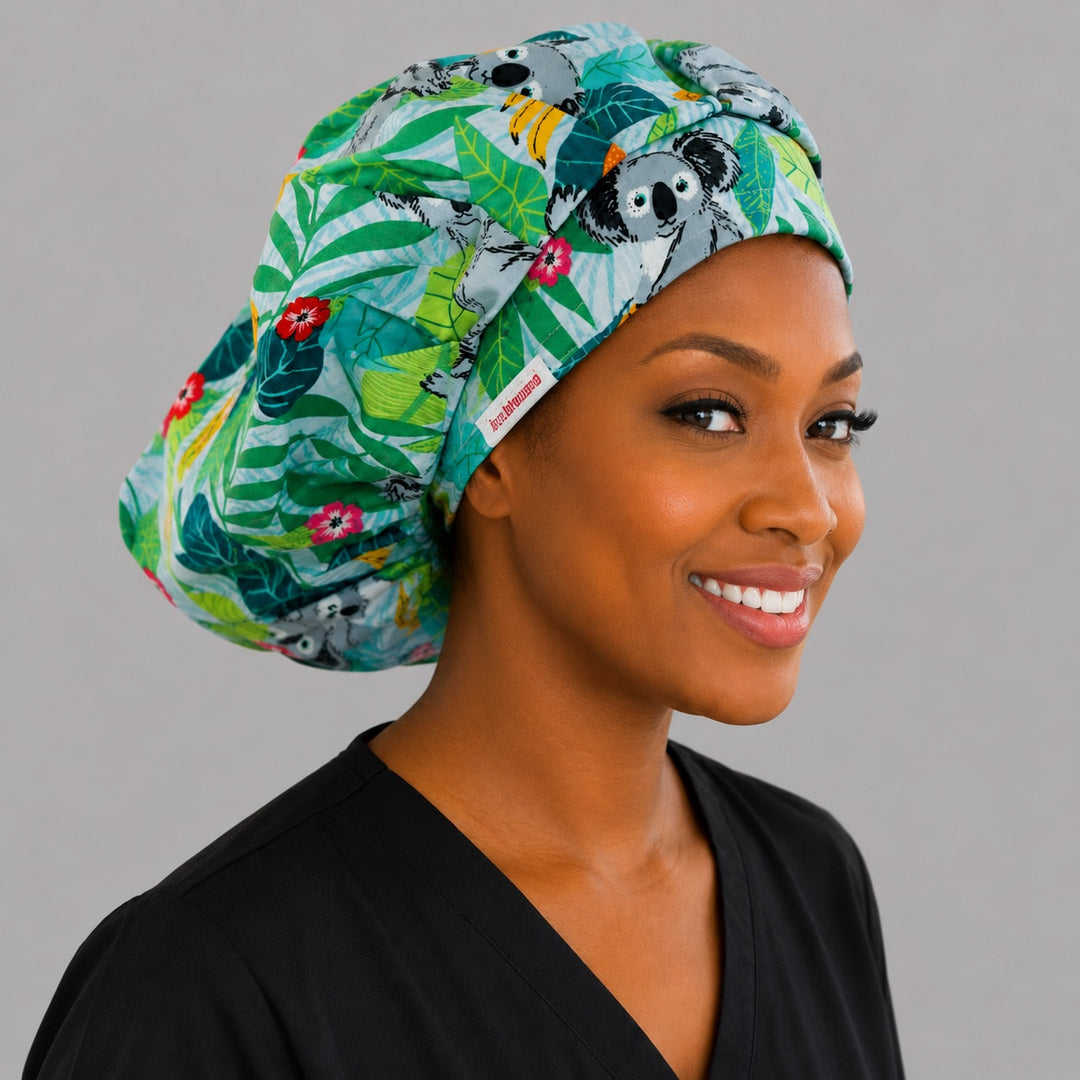 Koala bears tropical leaves bouffant scrub cap right side profile showing koalas among eucalyptus and hibiscus, OR World Australian wildlife nurse hat