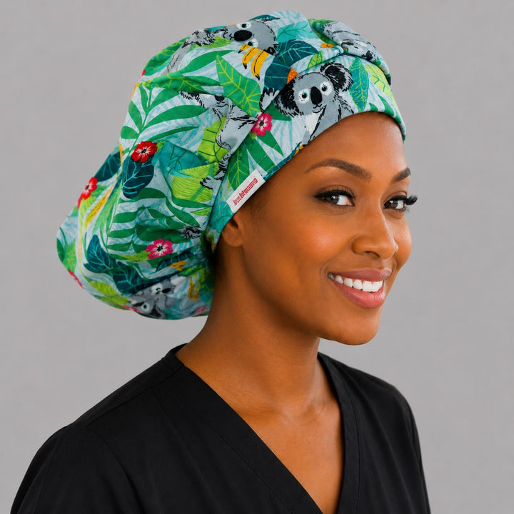 Koala bears tropical leaves bouffant scrub cap right side profile showing koalas among eucalyptus and hibiscus, OR World Australian wildlife nurse hat