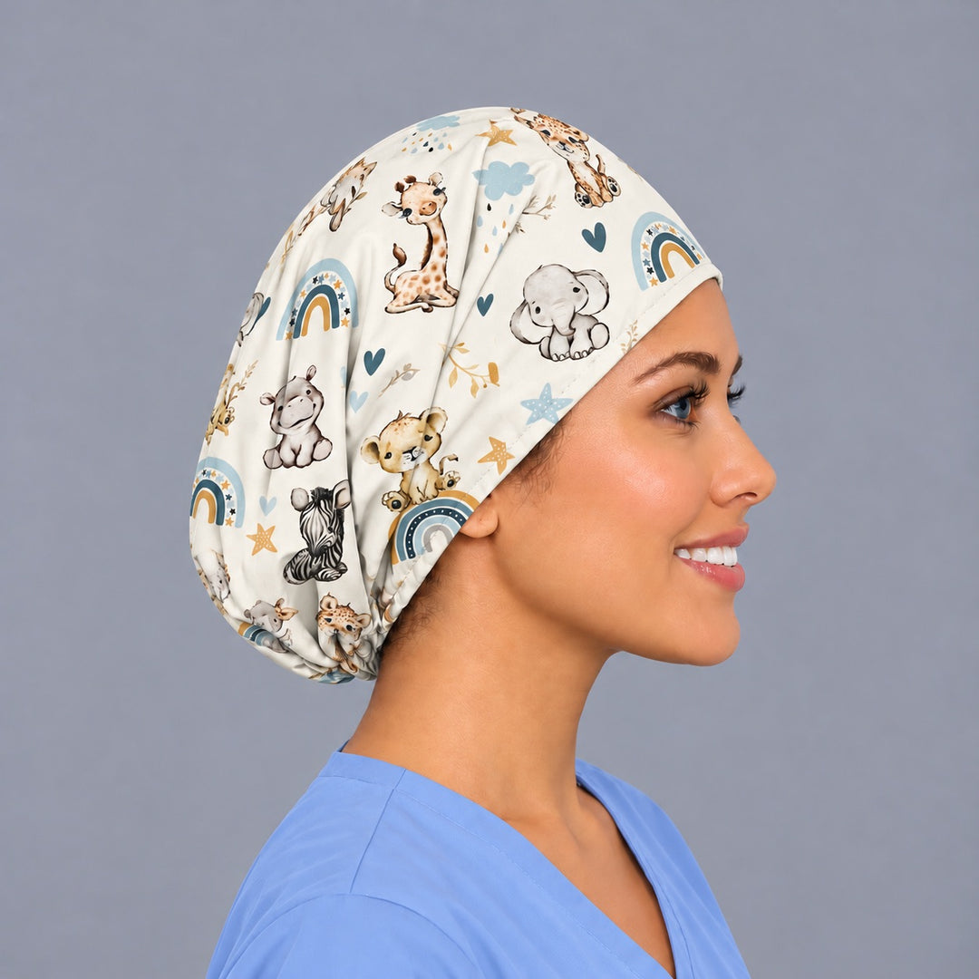 Right side profile of an L&amp;D nurse surgical cap, with a baby giraffe and elephant printed along the side panel and the elastic gathered behind the ear