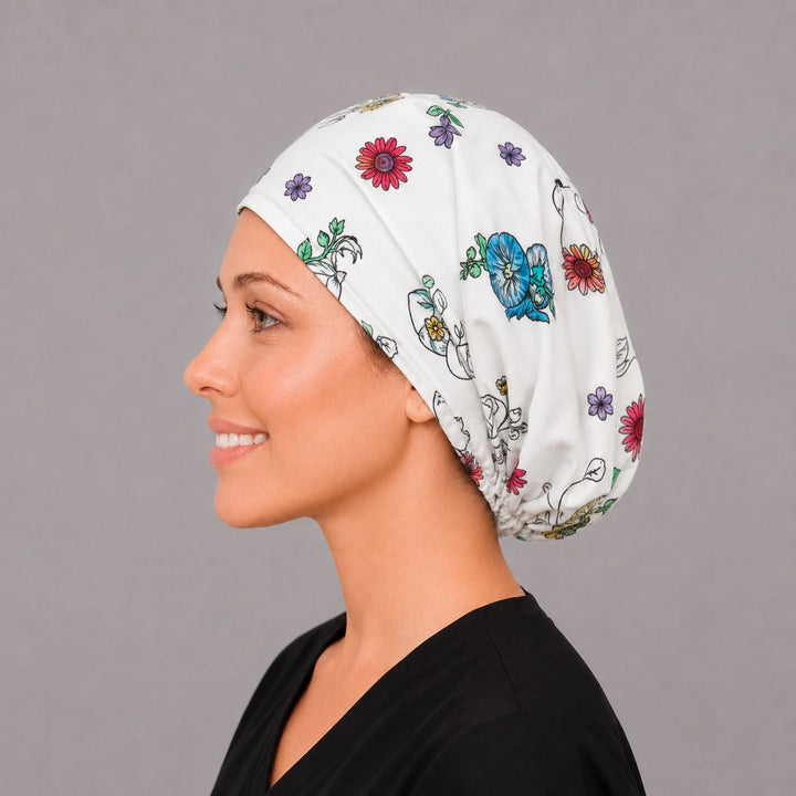 Labor and delivery floral Euro scrub cap, left side profile — blue pansy and violet print for midwives and NICU teams