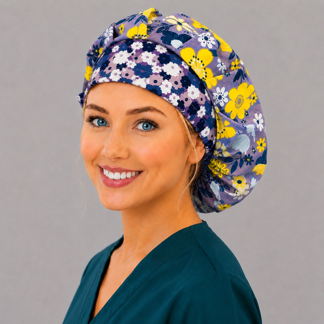 Lavender bloom bouffant scrub cap, left angled smiling view — yellow and navy floral print for OR nurses and surgical techs