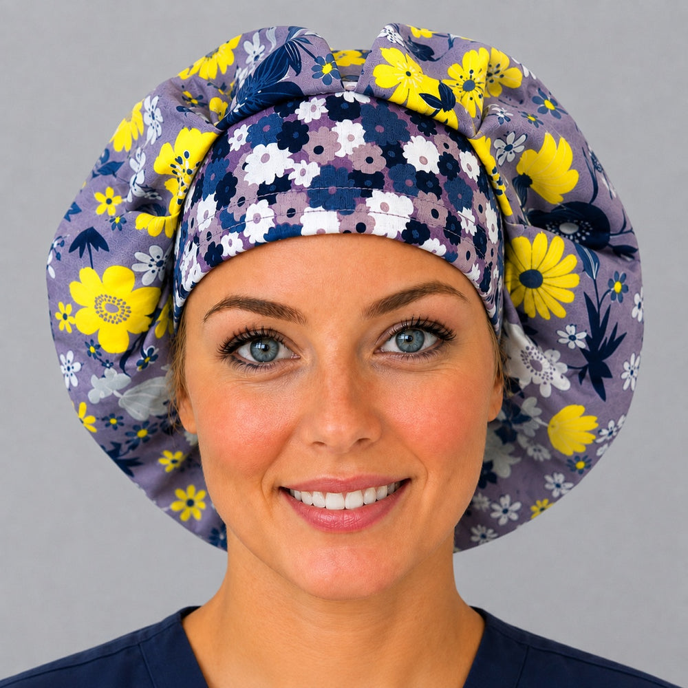 Woman wearing a lavender floral bouffant scrub cap, front view — yellow flowers and white daisies on purple with a floral band, adjustable women's surgical hat