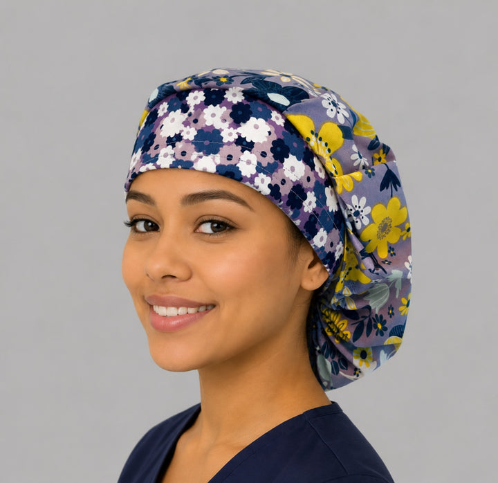 Lavender floral bouffant surgical cap for women, angled smiling view — yellow and white blooms on purple, roomy cap that secures long thick hair