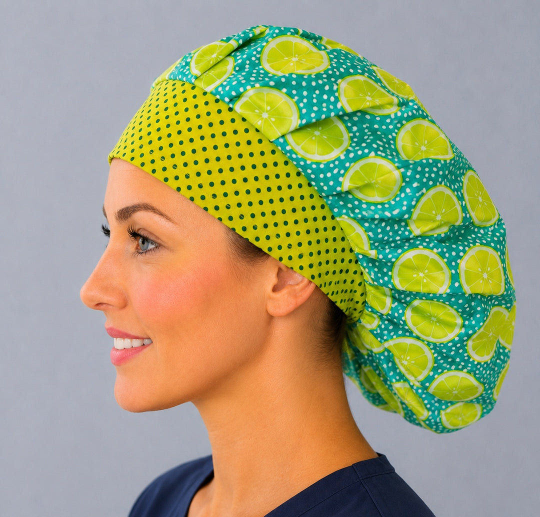 Profile view of the lemon lime citrus bouffant cap for women — roomy elastic fit, handmade fruit-print surgical cap made in the USA