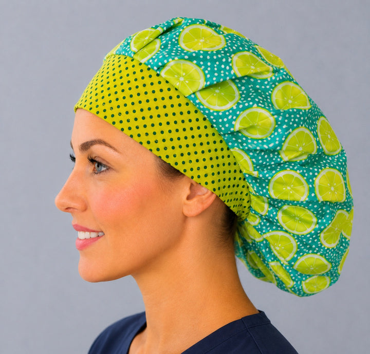 Profile view of the lemon lime citrus bouffant cap for women — roomy elastic fit, handmade fruit-print surgical cap made in the USA