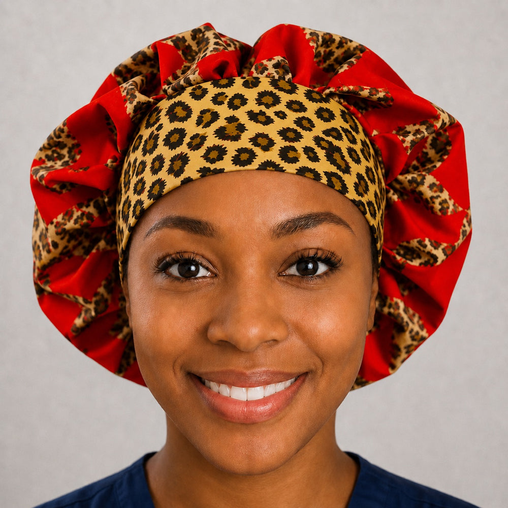 Woman wearing a leopard heart bouffant scrub cap with contrasting cheetah band, front view — red crown with leopard-spot band, adjustable women's surgical hat