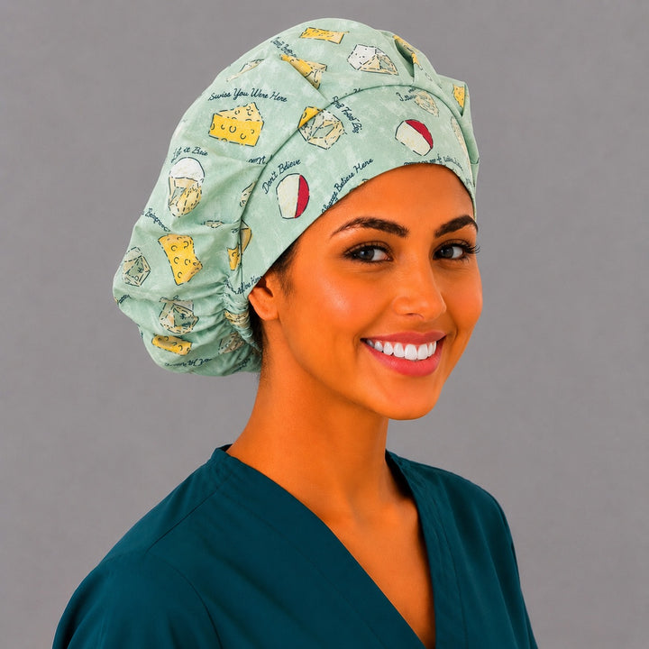 Let It Brie cheese bouffant cap for women, angled smiling view — funny food print surgical cap handmade in the USA