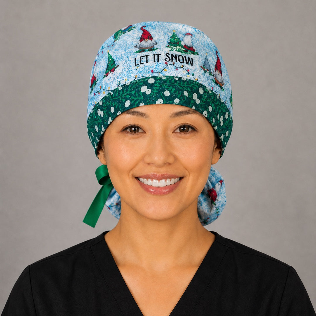 Let it Snome Christmas gnomes ponytail scrub cap back view close-up showing gathered pouch full of tree-gnomes, cardinals, Christmas lights and Let It Snome text on sky blue with green ribbon bow