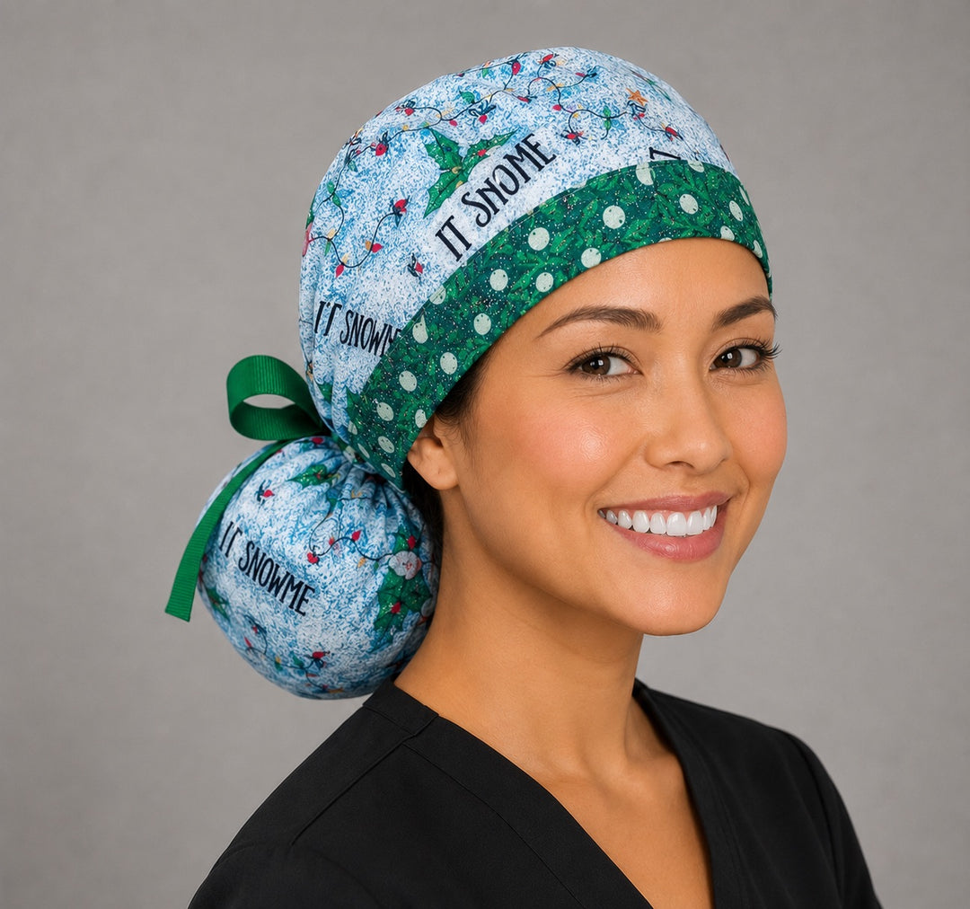 Let it Snome Christmas gnomes ponytail scrub cap left side profile showing gathered pouch of tree-gnomes and cardinals on sky blue with green snowball band and green ribbon tie
