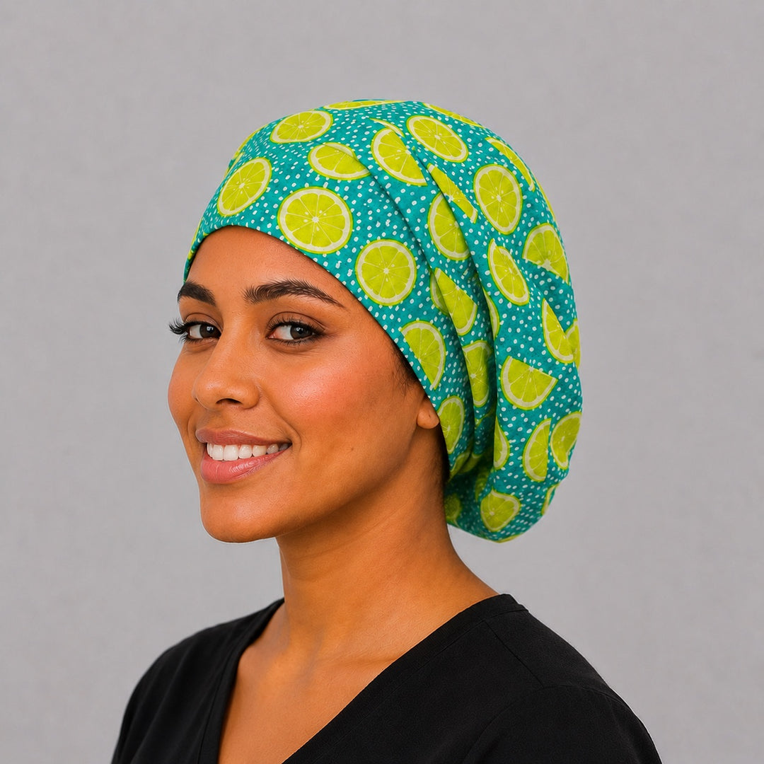 Lime Citrus Euro scrub cap on model — lemon lime fruit-print surgical hat for women, teal with green citrus slices, adjustable Euro OR cap for nurses & techs, satin lining option, OR World.