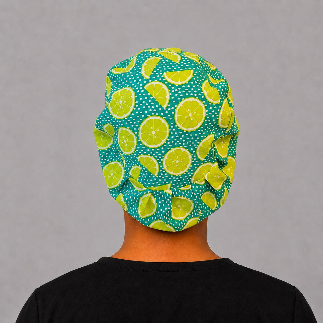 Back view of lime citrus Euro scrub cap showing the elastic toggle fit — handmade-in-USA OR World fruit-print surgical hat for women.