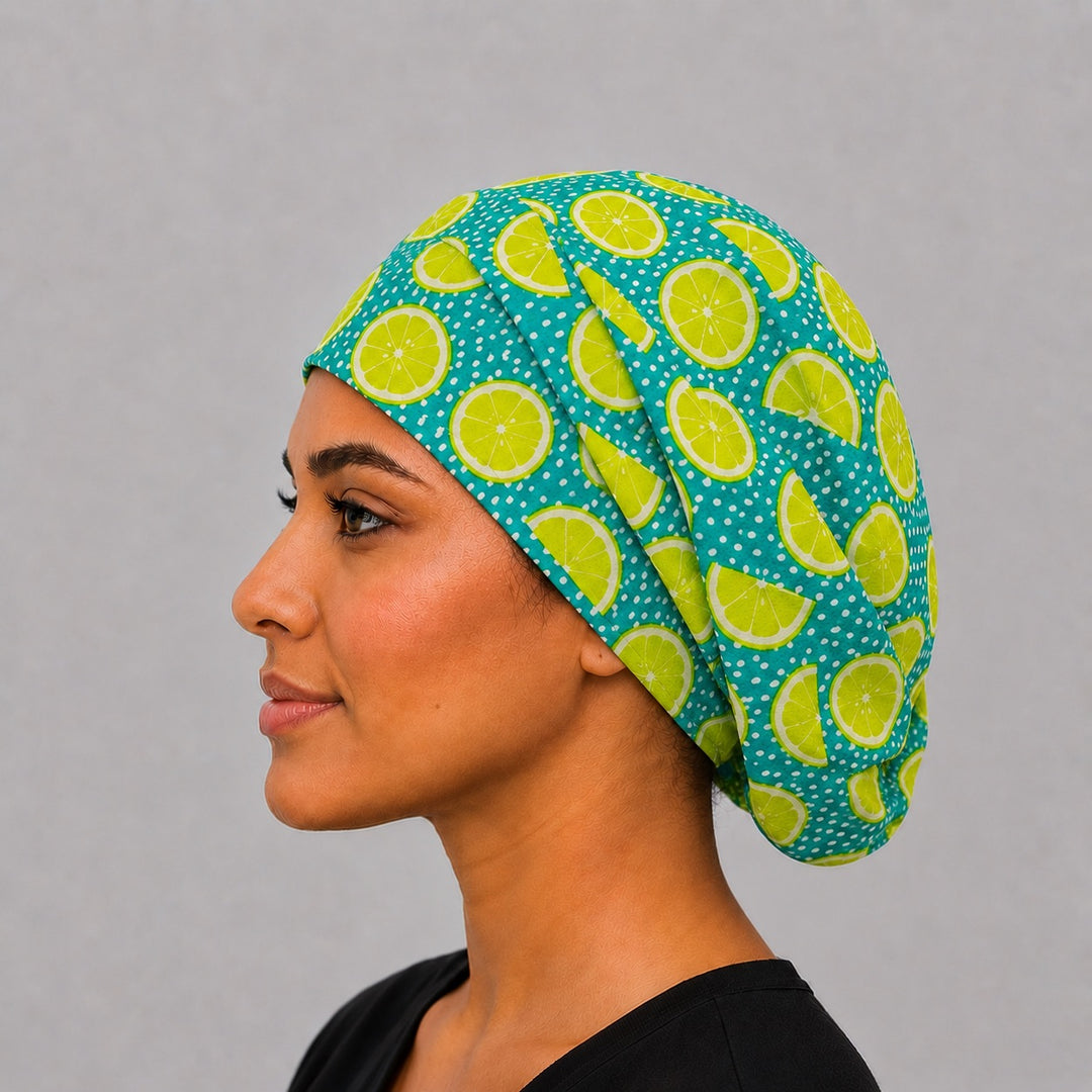 Side view of lime citrus Euro scrub cap with elastic adjustable back — handmade USA fruit-print surgical hat for OR nurses &amp; techs.