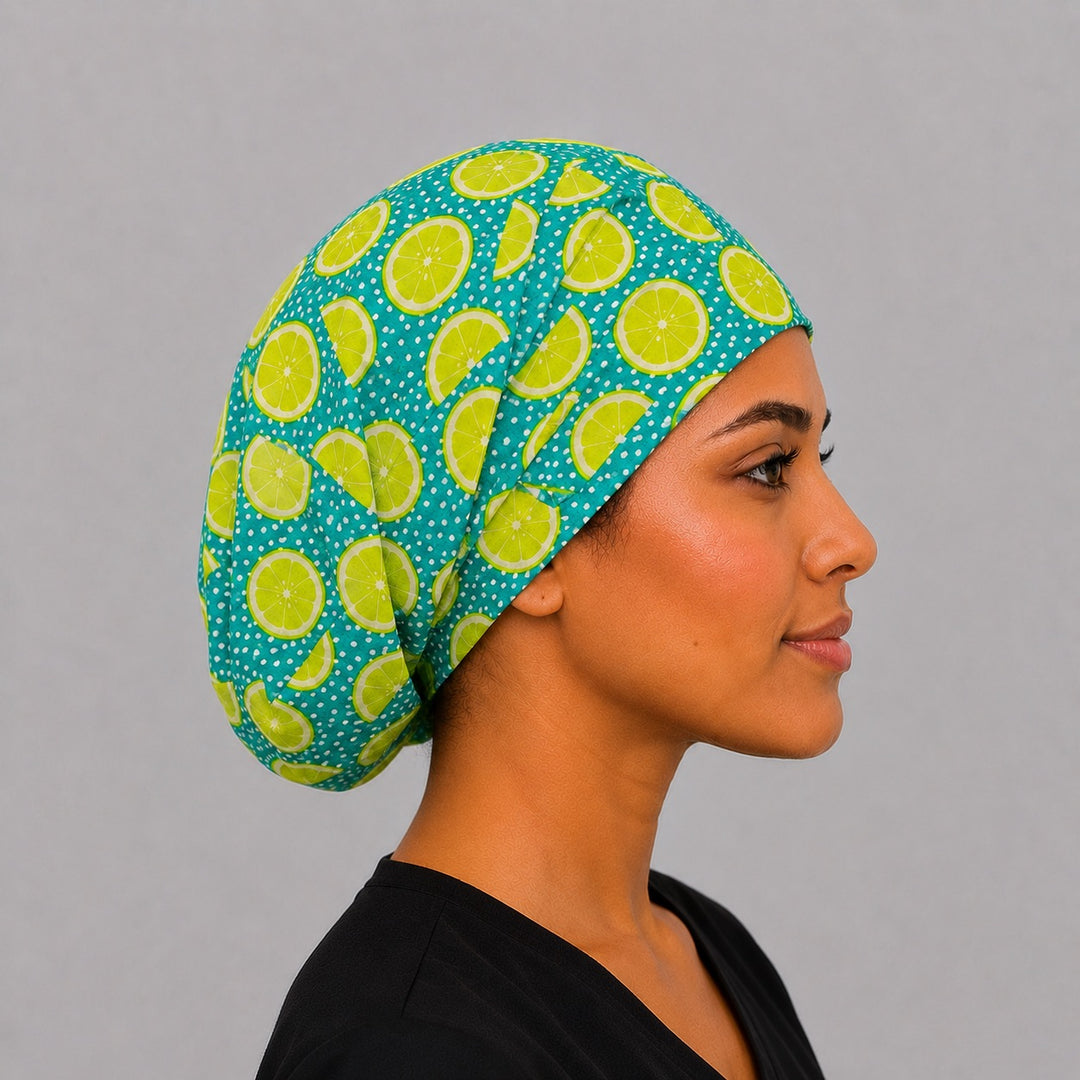 Profile view of lime citrus Euro scrub cap on a model — handmade-in-USA fruit-print surgical hat, cheerful gift for nurses &amp; vets.