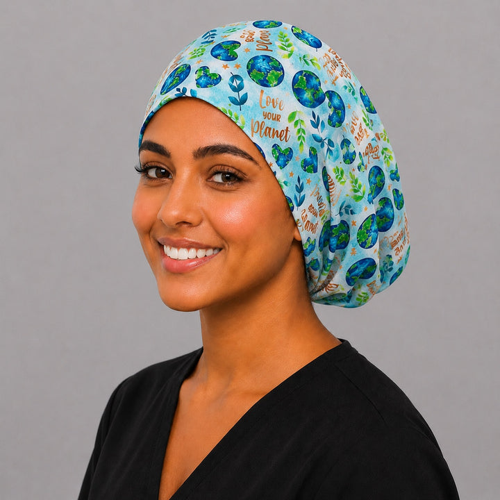 Love Your Planet Earth Day Euro scrub cap, three quarter view on a model, adjustable handmade USA surgical hat for women and OR nurses.