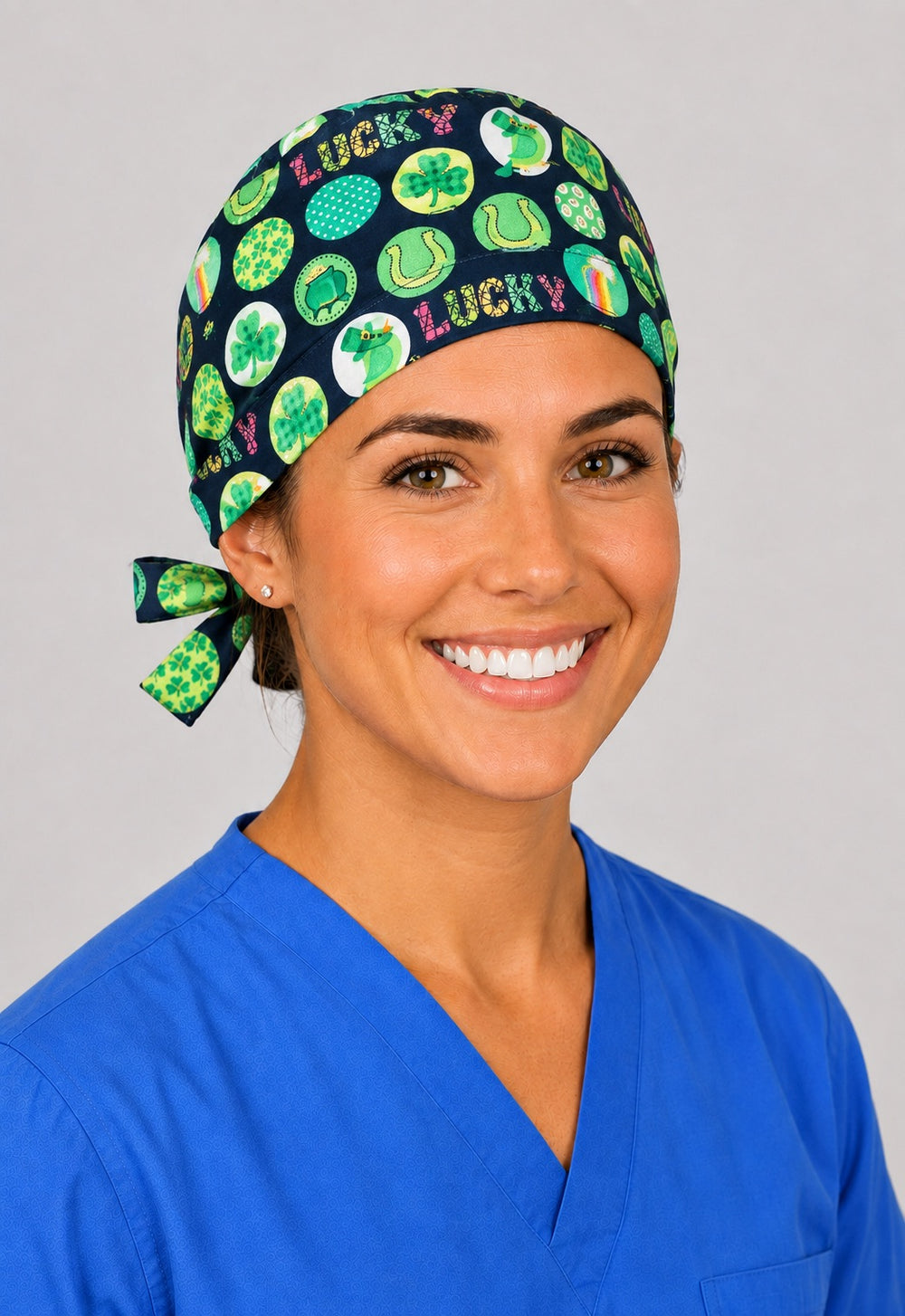 Left profile of lucky horseshoe and shamrock scrub cap for women with short hair, navy adjustable OR cap