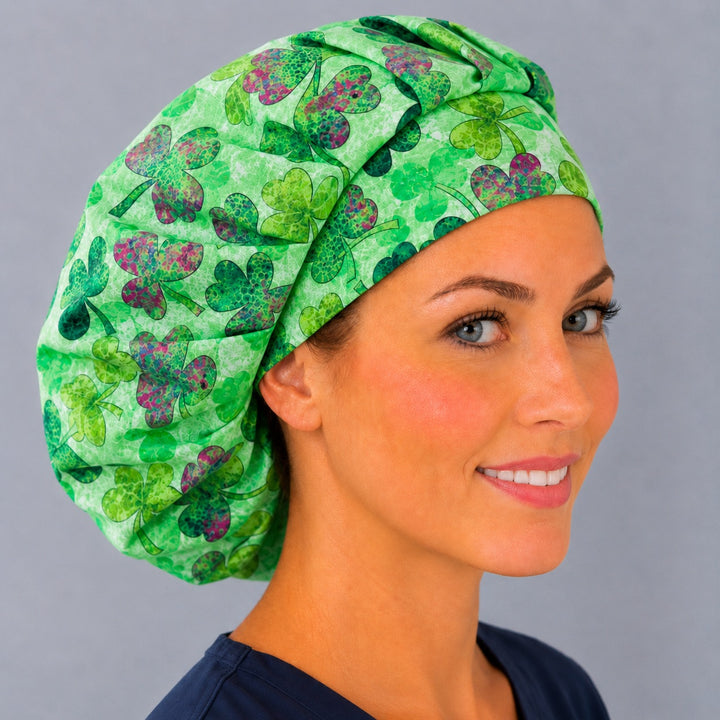 Lucky shamrock bouffant surgical cap for long hair, right angled view — deep gathered fit that secures thick or braided hair