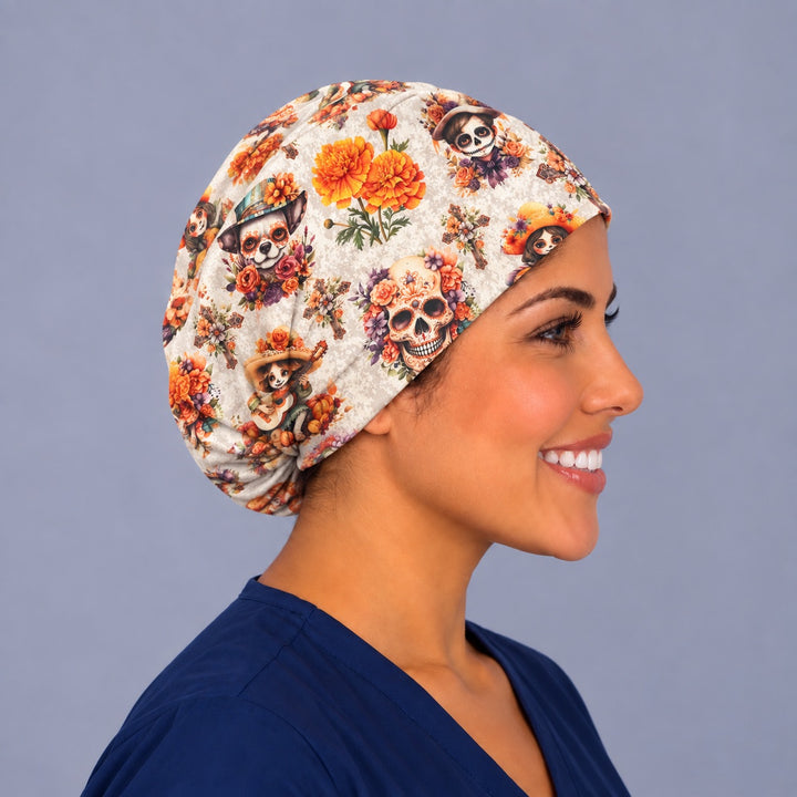 Right side profile of the Mexican marigold Euro scrub cap on an OR nurse, flower-crowned sugar skull, skeleton chihuahua and marigold bouquets