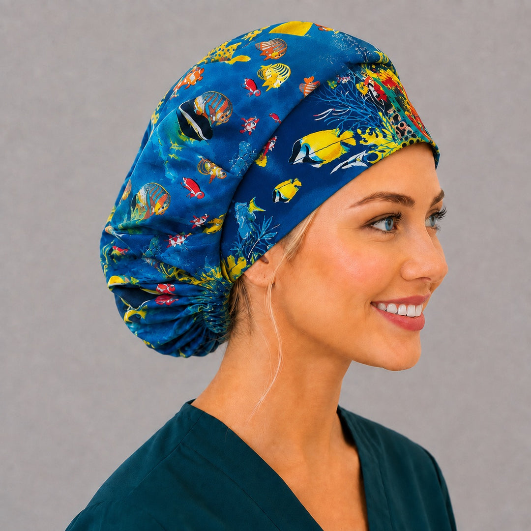 Marine life bouffant scrub cap, right side profile — yellow butterflyfish and clownfish reef print for OR nurses and surgical techs