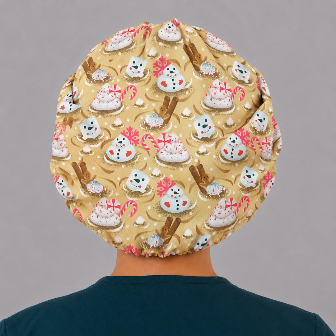 Full back view of the marshmallow snowman bouffant scrub cap — flat lay showing candy canes and peppermint whipped cream on gold