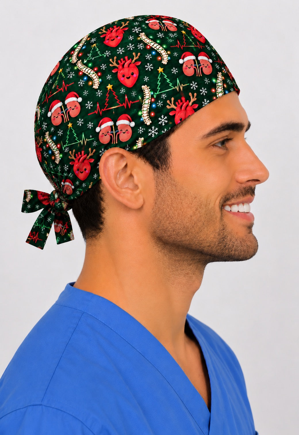 Left profile of a medical Christmas scrub hat, where EKG heartbeat lines form little Christmas trees between the organ characters, with the fit snug above the ear