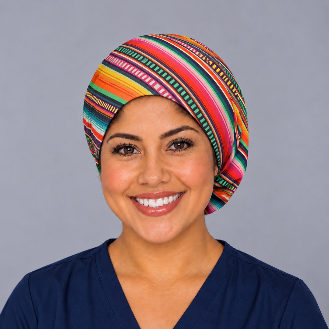 Nurse wearing a Mexican blanket bouffant surgical hat, front view, bright diagonal serape stripes