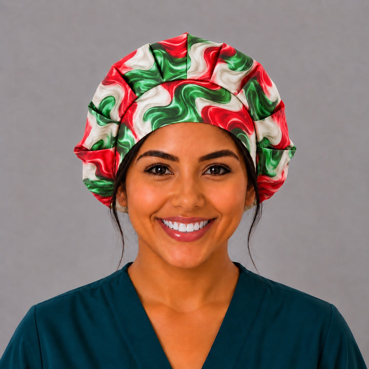 Smiling nurse in teal scrubs wearing a Mexican fiesta swirl bouffant scrub cap, front view of the pleated crown fanning out above a smooth fitted band