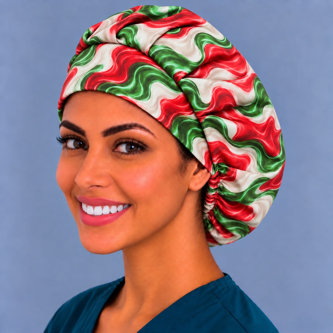 Left three-quarter angle of a smiling healthcare worker in a Mexican flag colors bouffant scrub hat, with wavy red and green bands across the side panel