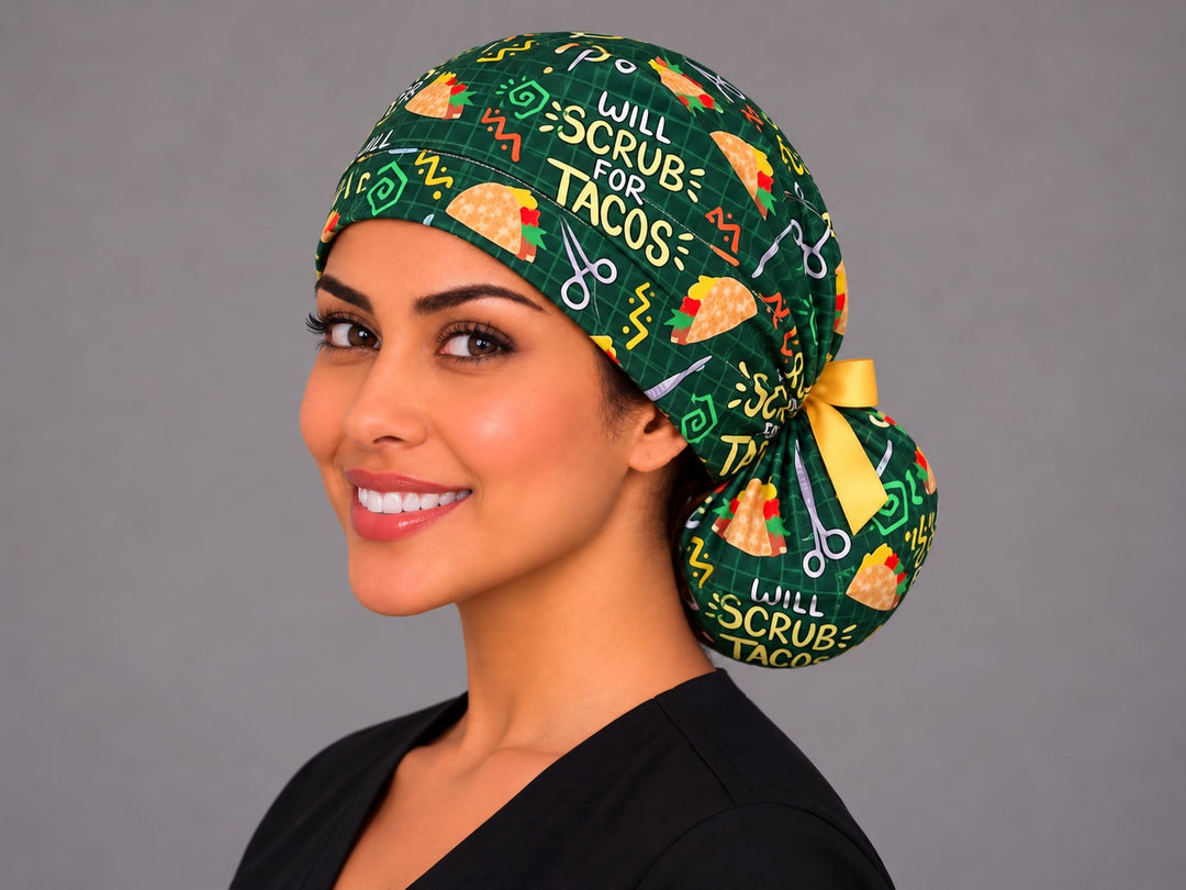 Three-quarter angle of a smiling healthcare worker in a Mexican food humor ponytail cap, with hemostats and tacos shown at true print scale