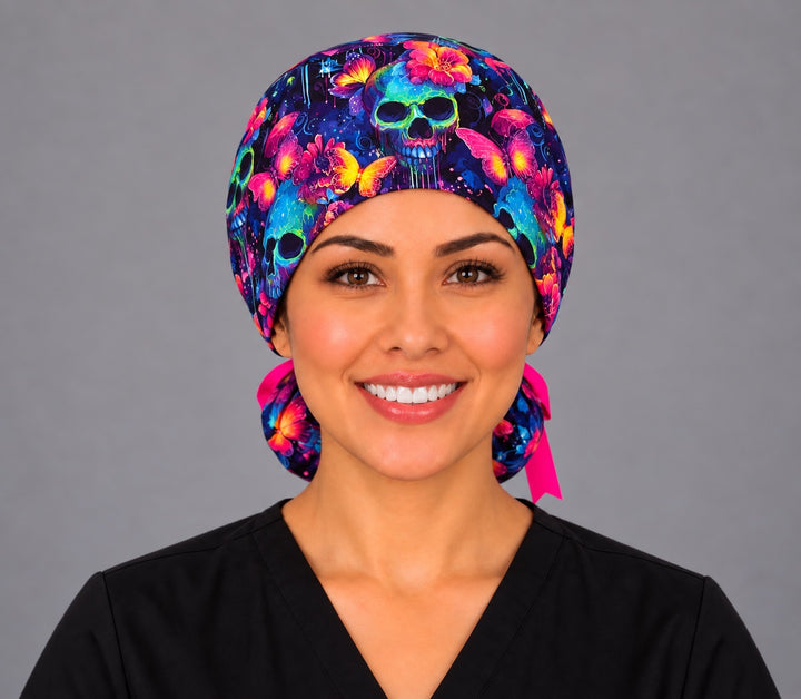 Nurse wearing a Mexican neon calavera ponytail surgical hat, front view, glowing sugar skulls, butterflies and fuchsia flowers