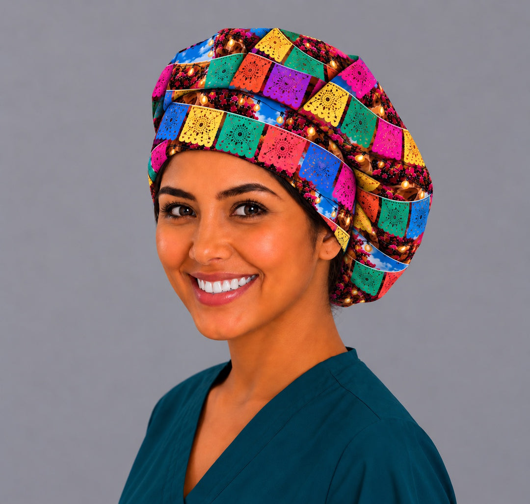 Right side of a Mexican street fiesta bouffant nurse cap with papel picado, bougainvillea flowers and café lights
