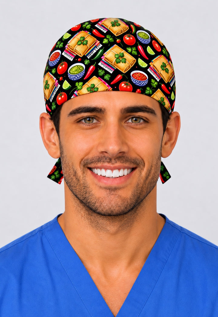 Front view of a Mexican tamales surgical cap for men with corn husk tamales, limes and tomatoes