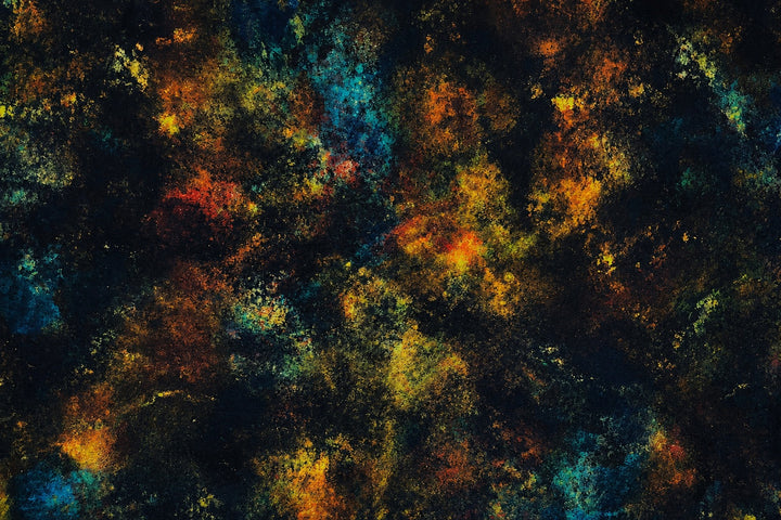 Close-up of rustic midnight galaxy cosmic nebula fabric swatch, navy gold rust and teal speckle men&