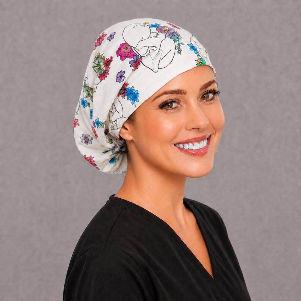 Midwife baby floral Euro surgical cap, right angled view — elastic adjustable back with full head coverage for long hair