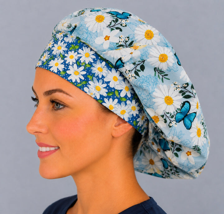 Angled view of the monarch butterfly daisy bouffant cap for women on a smiling nurse — handmade spring floral surgical cap, USA made
